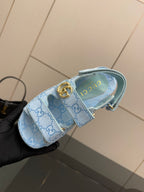 Gucci ladies light blue GG-pattern sneaker close-up with gold buckle and strap