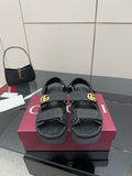 Gucci ladies platform sandals in dark fabric with GG pattern straps and gold-tone buckle