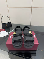 Gucci ladies platform sandals in dark fabric with GG pattern straps and gold-tone buckle