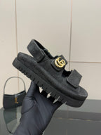 Gucci ladies platform sandals on hand, dark GG-pattern upper and gold-tone logo buckle