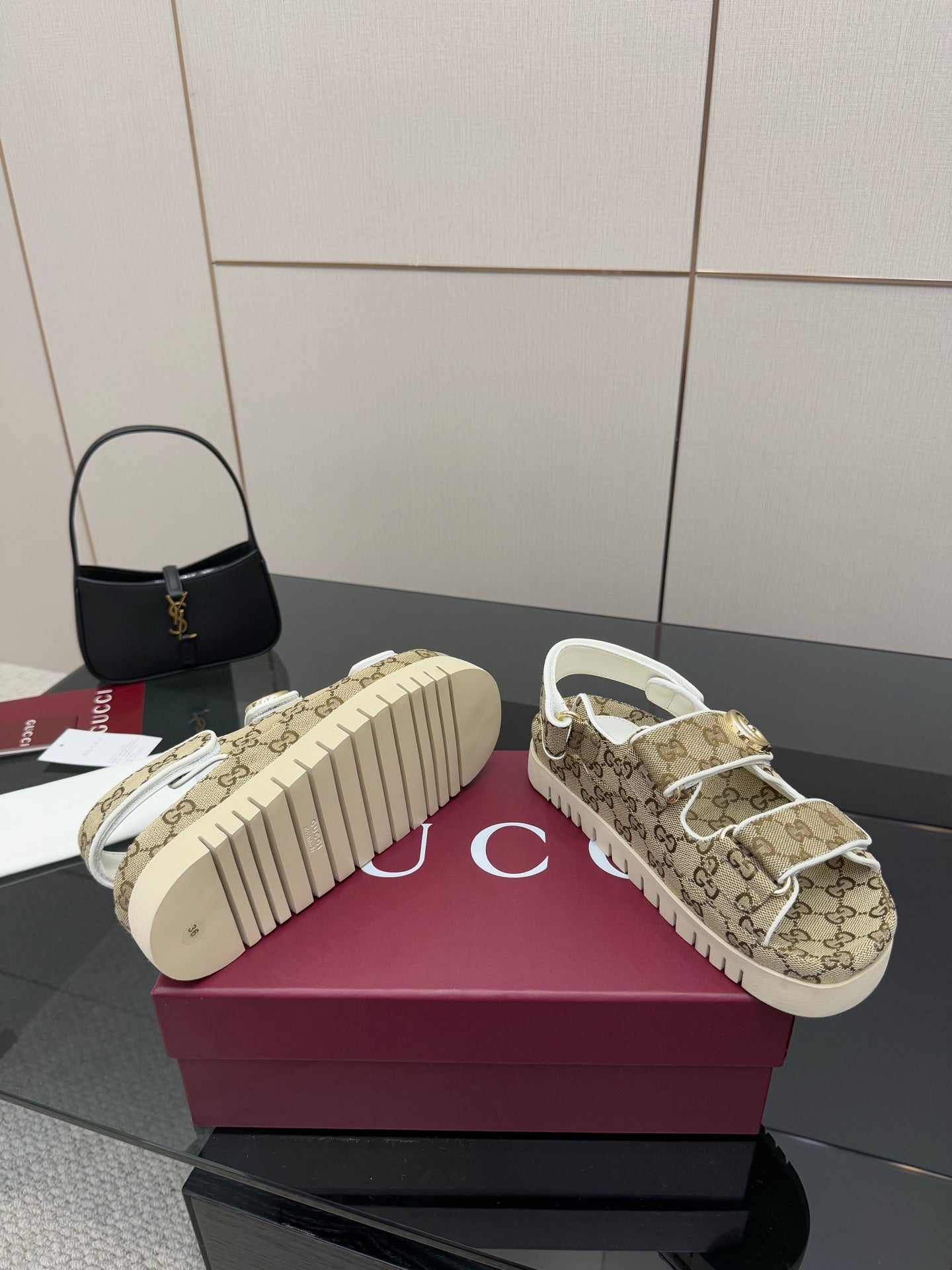 Gucci women’s sneakers outsole view with beige GG uppers and white tread