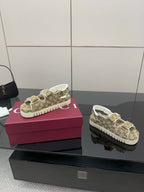 Gucci women’s sneakers side view in beige GG canvas with white soles