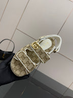 Gucci women’s sneakers with beige GG pattern and white lace edge detail