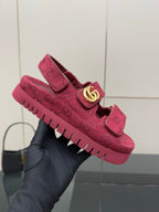 Gucci women’s fuchsia platform sneakers held up, GG monogram upper and gold logo strap