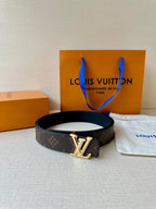 Brown monogram leather belt with gold-tone LV buckle, laid with dust bag and boxes