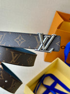 Blue monogram leather belt with large gold-tone LV-style buckle centerpiece