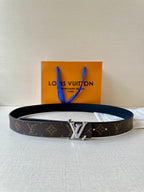 Brown monogram leather belt with gold-tone square buckle and dark adjustable holes
