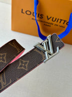 Silver LV buckle on dark monogram belt strap with pink trim