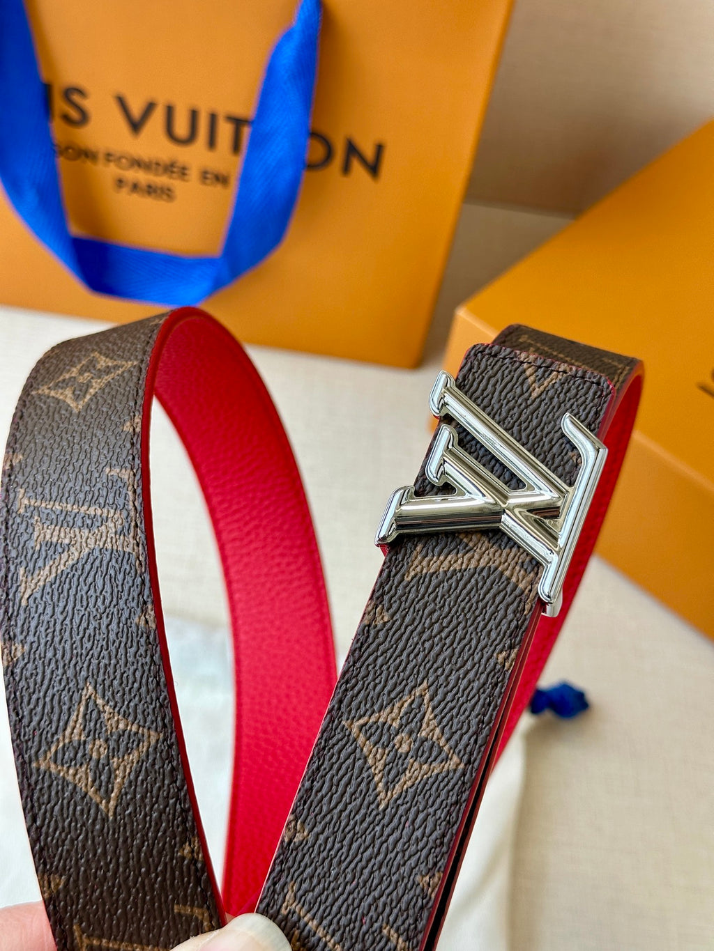 Louis Vuitton monogram belt buckle with red lining leather and silver hardware