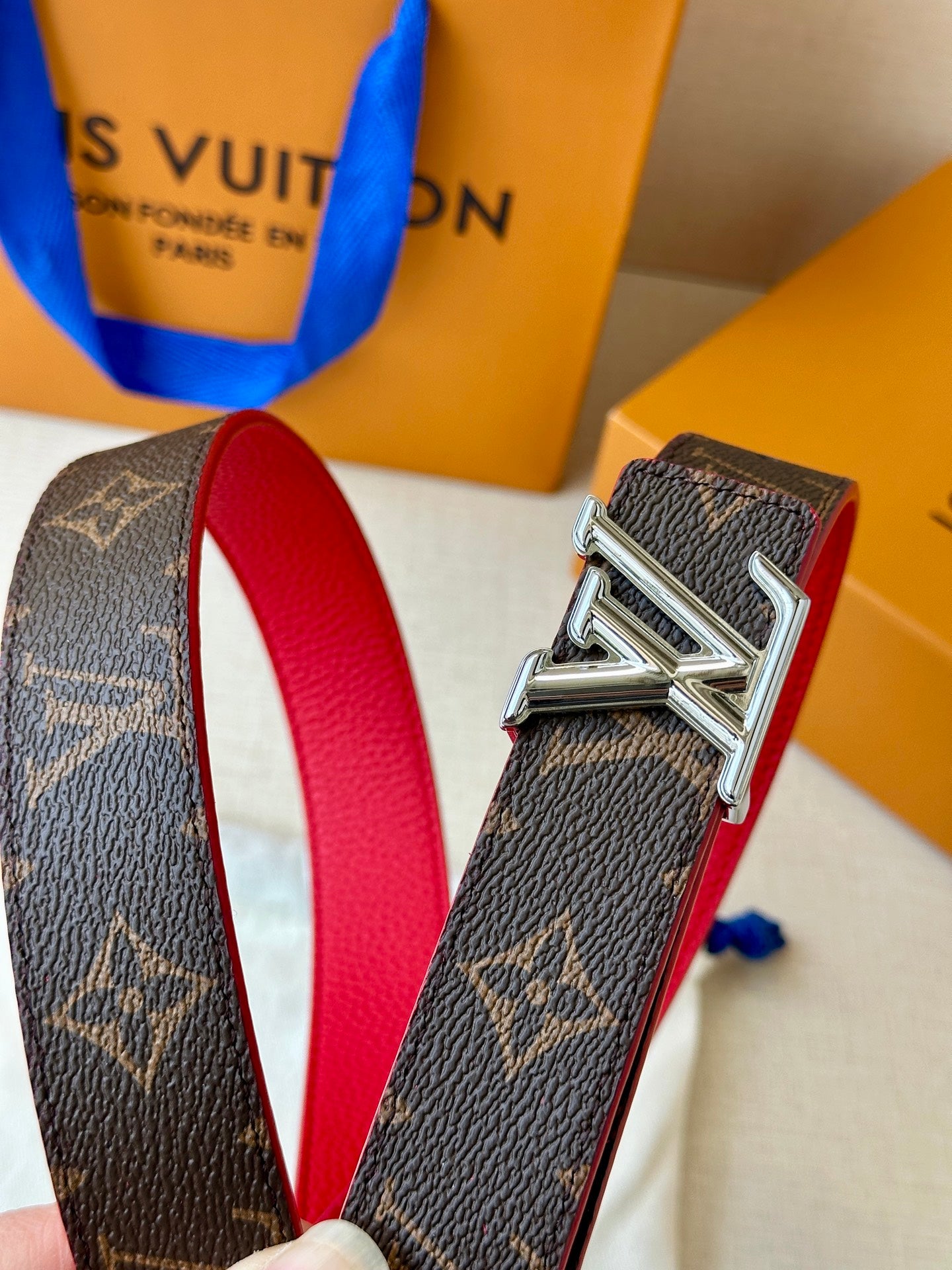 Louis Vuitton monogram belt buckle with red lining leather and silver hardware