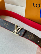 Louis Vuitton monogram belt with red lining and silver LV buckle close-up