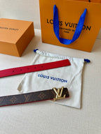 Louis Vuitton monogram belt with red lining and silver LV buckle on dust pouch