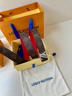 Louis Vuitton monogram belt with red lining and silver LV buckle in gift box