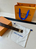 Monogram belt with dark blue lining and gold-tone LV buckle on pouch