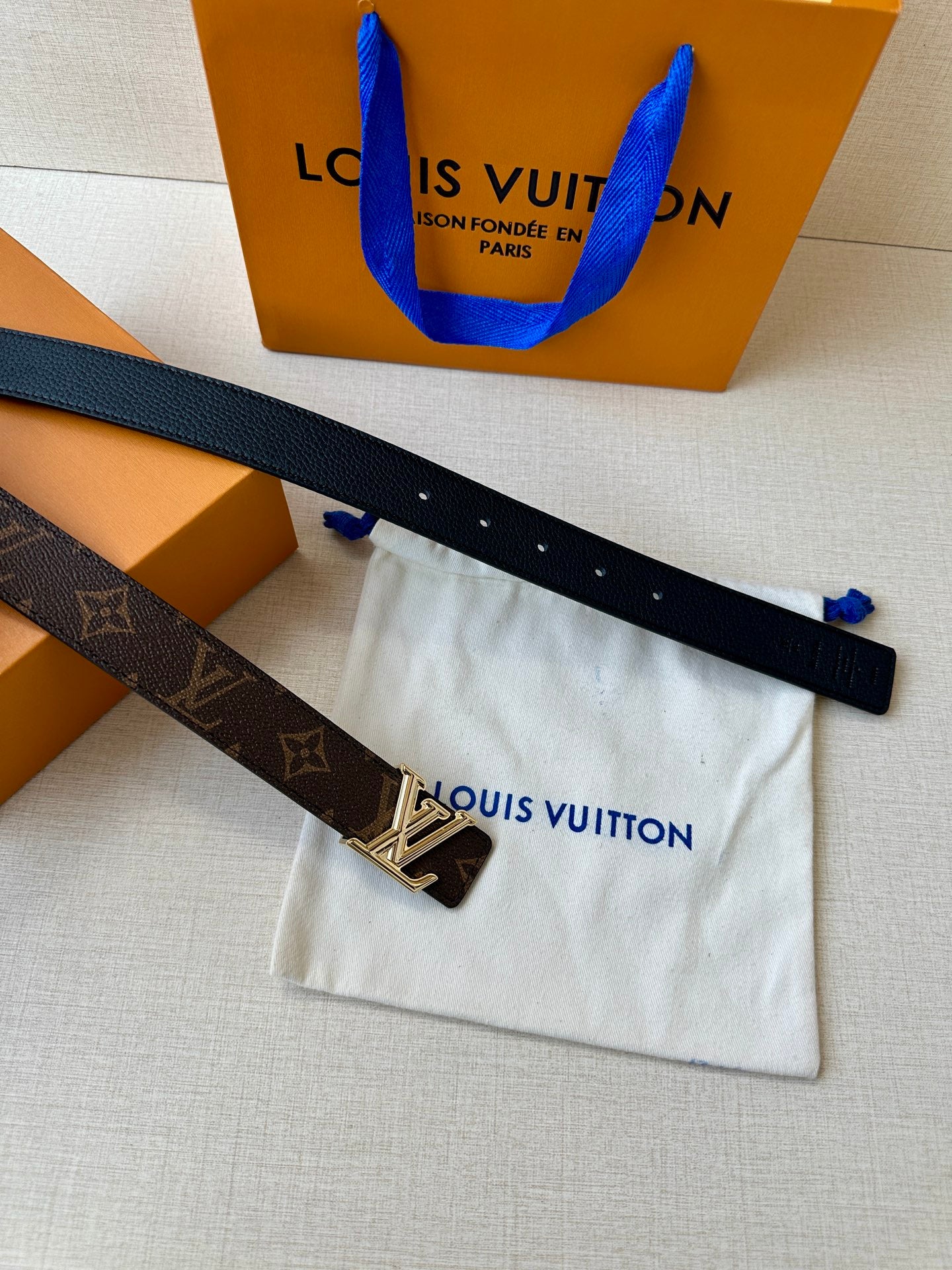 Monogram belt strap with dark blue side and gold-tone LV buckle