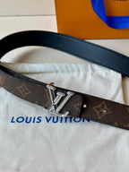 Close-up monogram belt strap with silver-toned LV buckle and dark leather edge