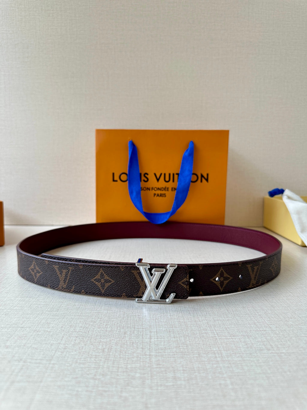 Louis Vuitton monogram canvas belt with silver-tone buckle and burgundy lining