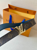 Monogram belt with gold LV buckle on dark textured leather strap