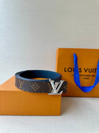 Monogram belt with gold LV buckle on dark patterned strap