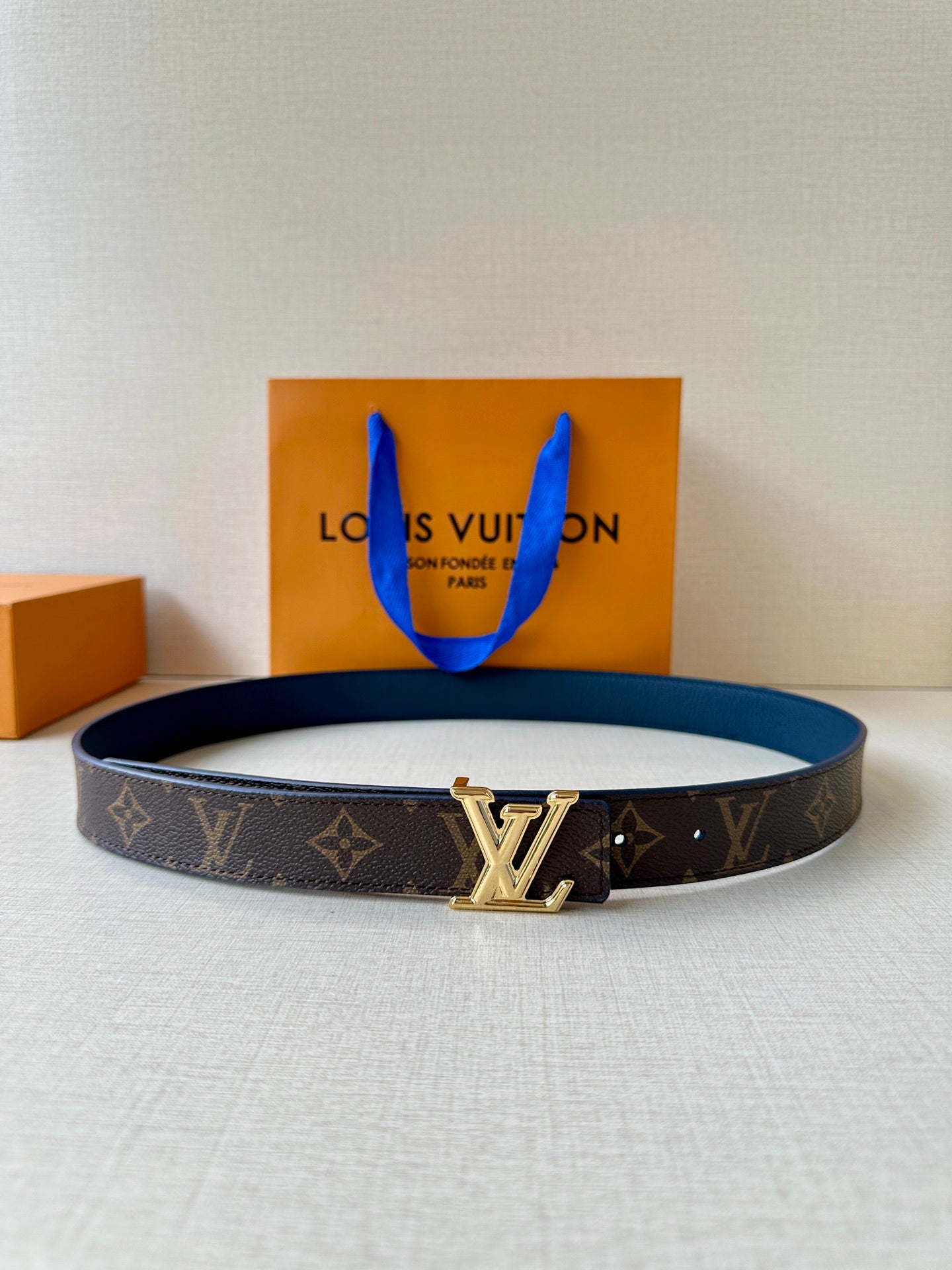 Louis Vuitton belt in dark monogram canvas with gold LV buckle