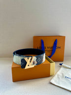 Two-tone monogram leather belt with gold-tone LV buckle and visible strap holes.