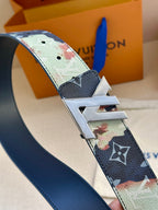 Monogram leather belt strap detail with gold-tone double-prong LV buckle.