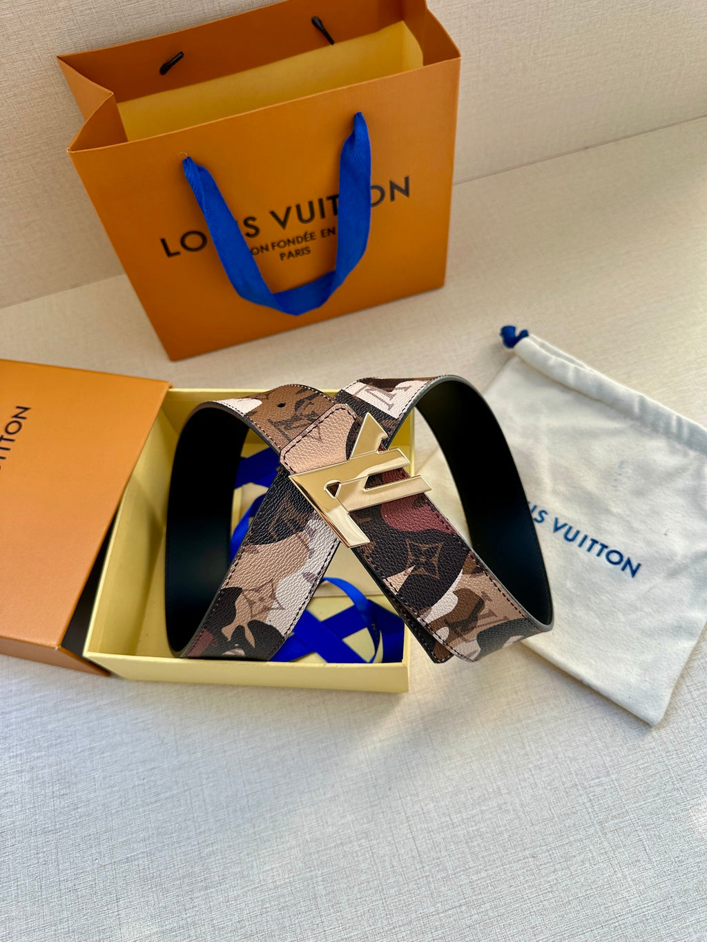 Monogram belt in gift box with gold-tone buckle and patterned strap
