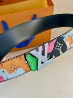 Multicolor Louis Vuitton belt detail: black strap with gold buckle and green accent