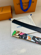Multicolor belt with black strap, gold buckle, and graphic pattern on white pouch