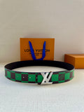 Louis Vuitton belt with black leather strap and green check webbing, silver buckle