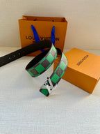 Louis Vuitton belt with black leather band, green check pattern and silver buckle