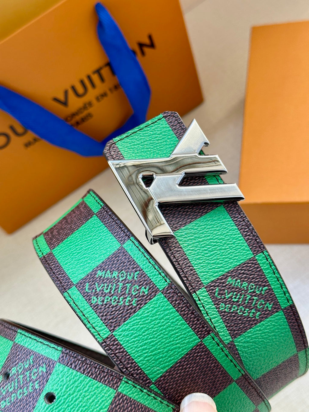 Louis Vuitton belt with green check strap and large silver buckle