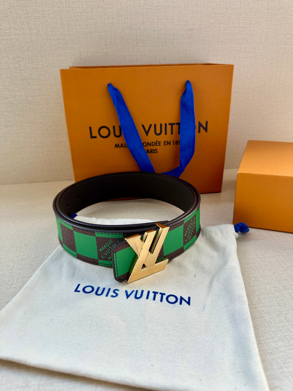Louis Vuitton belt with black strap, green check webbing and gold-tone buckle