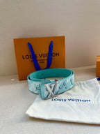 Turquoise Louis Vuitton belt with gold-tone LV buckle and monogram pattern on pouch