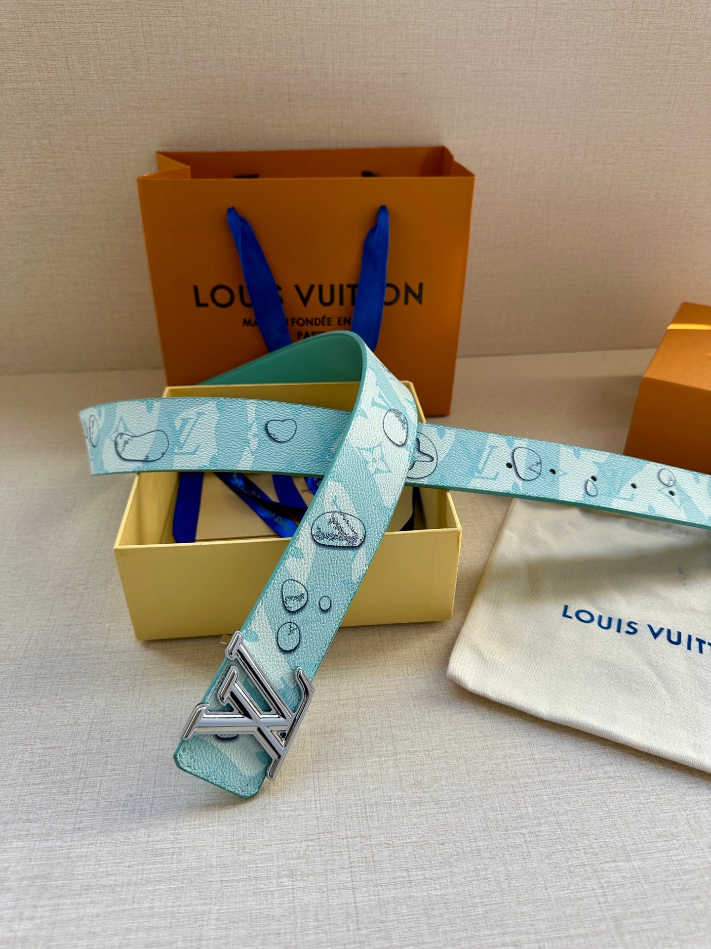 Turquoise logo-print belt with gold-tone LV buckle and matching small pouch