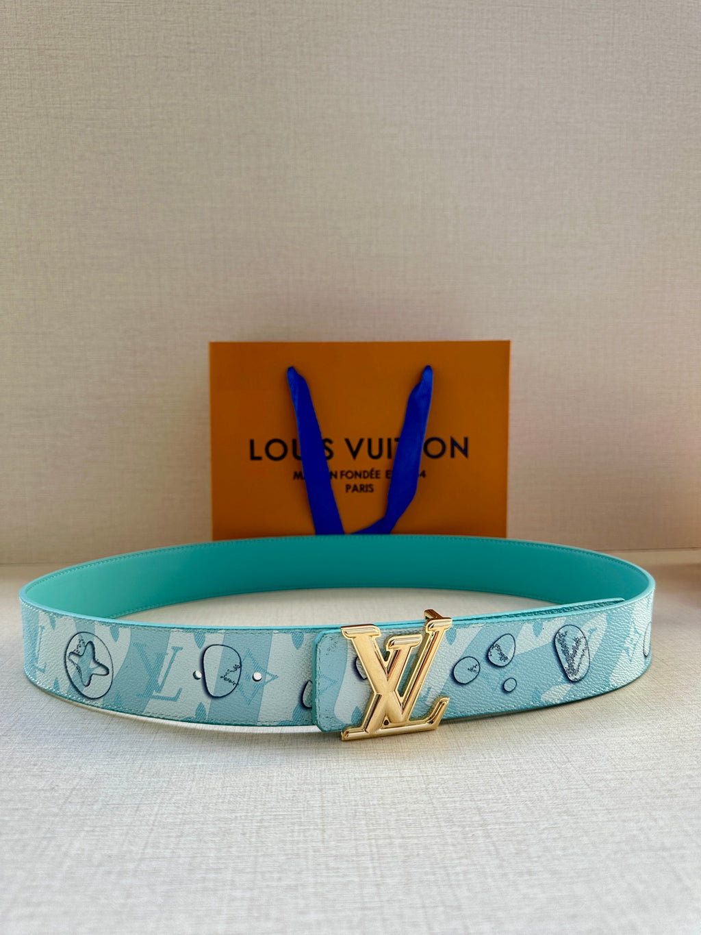 Turquoise logo-print Louis Vuitton belt with gold-tone LV buckle, adjustable strap