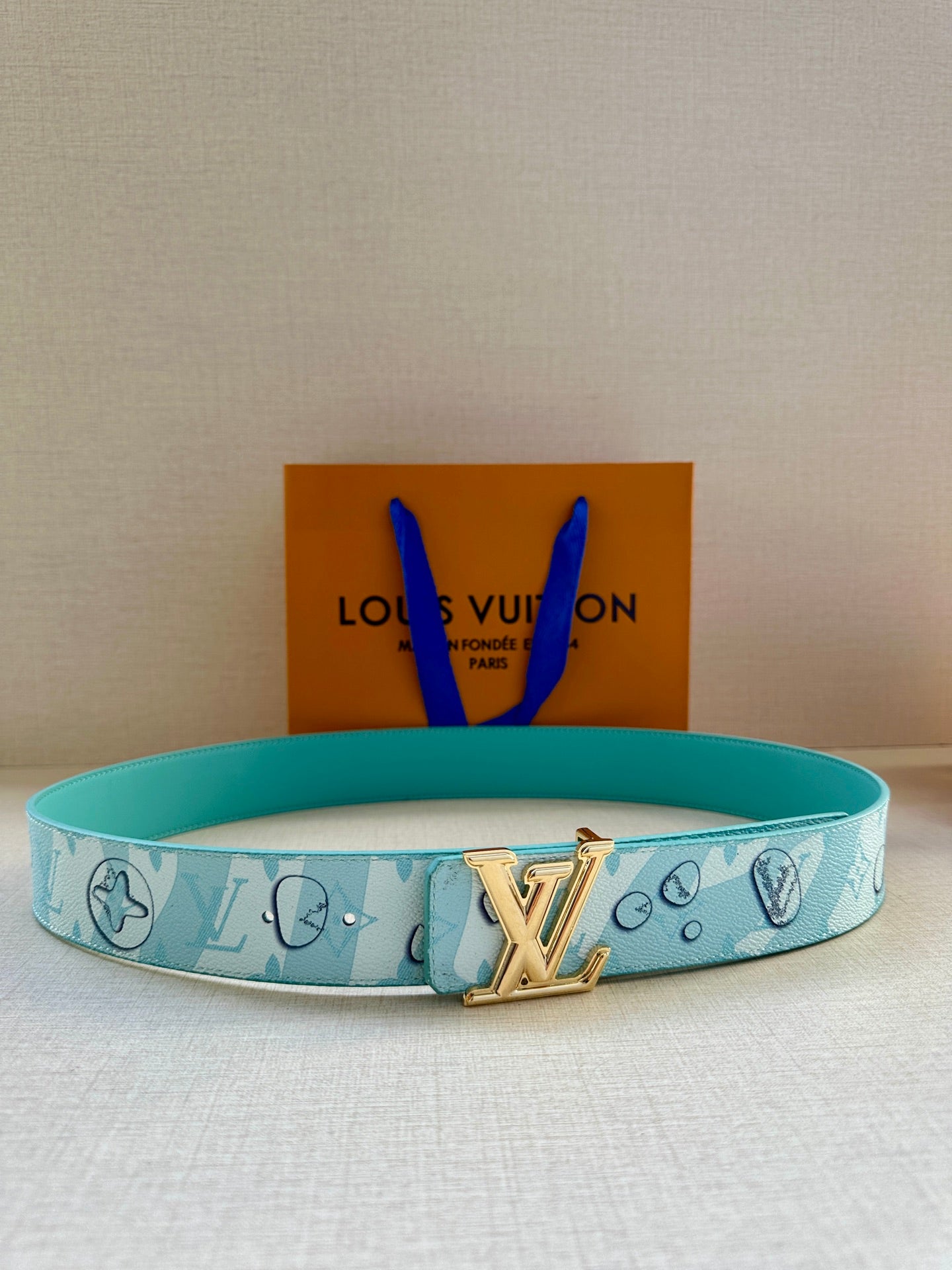 Turquoise logo-print Louis Vuitton belt with gold-tone LV buckle, adjustable strap