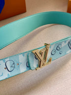 Turquoise belt strap detail with gold-tone LV buckle and monogram motif pattern