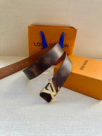 Dark brown leather belt with silver-tone LV buckle and pin-hole strap end.