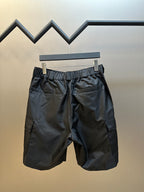 Prada nylon shorts, black, back view with elastic waistband and back pocket detail