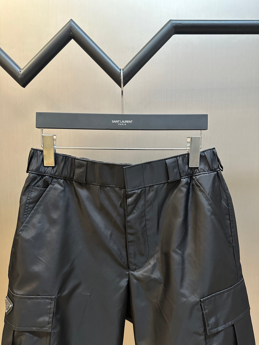 Prada nylon shorts, black, front view with elastic waistband and side cargo pockets