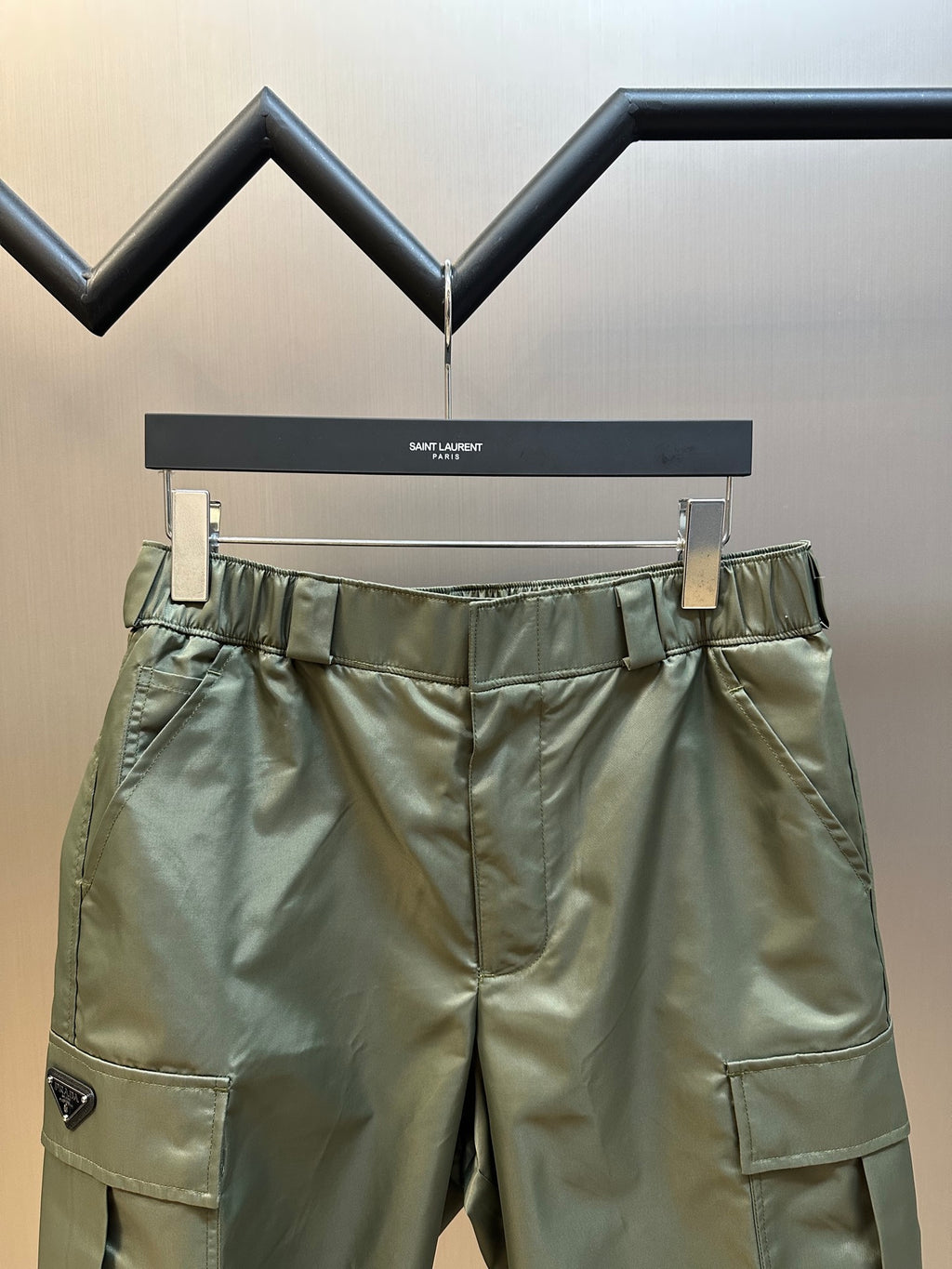 Prada nylon cargo shorts with elastic waistband, belt loops, and side flap pockets