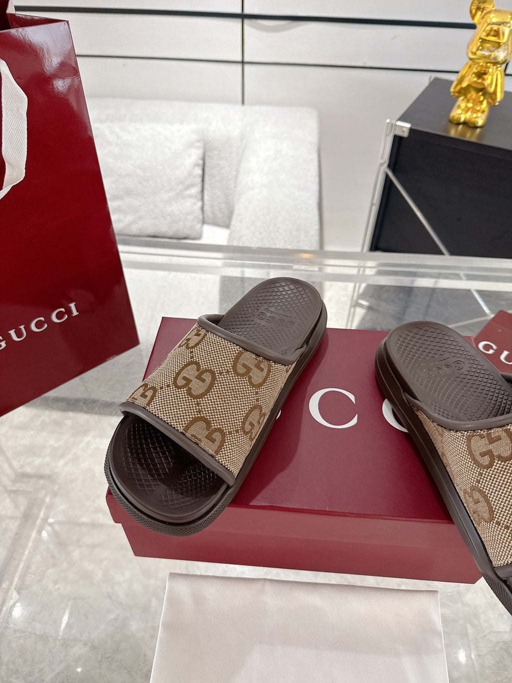 Gucci GG canvas slide sandals, tan upper with textured dark footbed
