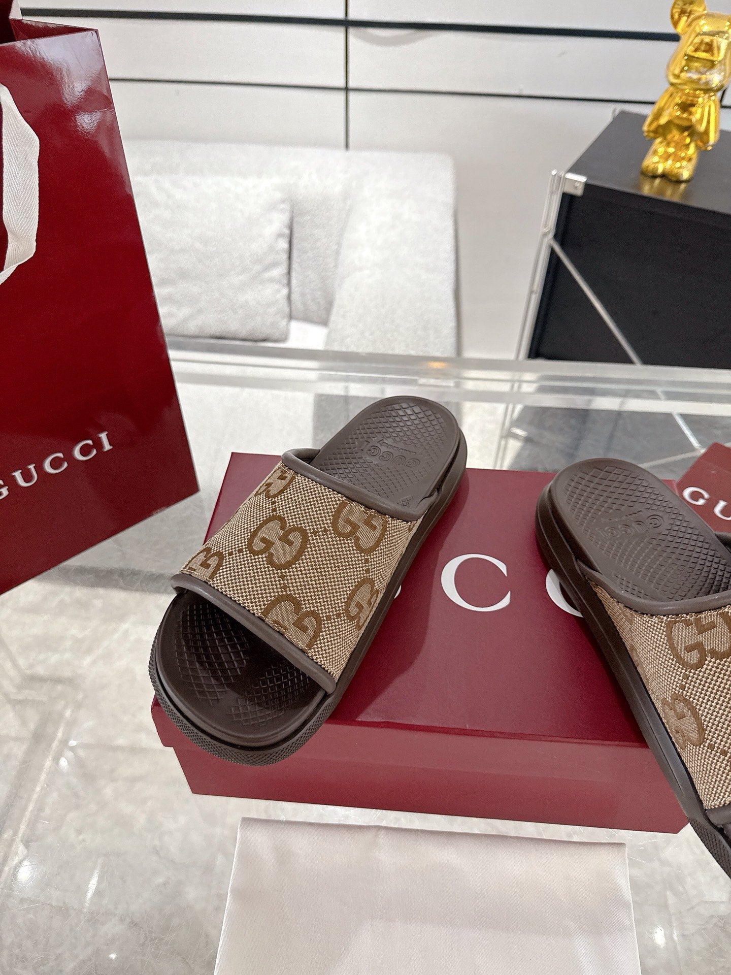 Gucci GG canvas slide sandals, tan upper with textured dark footbed
