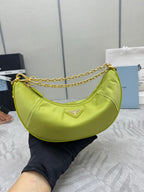 Lime green crescent shoulder bag with gold chain strap and logo plaque