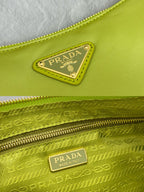 Lime green bag with Prada logo plaque and top zip closure details