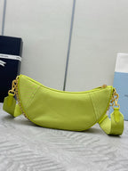 Lime green crescent shoulder bag with adjustable strap and gold chain hardware