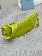 Lime green crescent shoulder bag with gold chain strap and logo patch