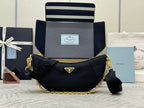 Prada crescent hobo bag in dark navy with gold chain strap and leather logo patch