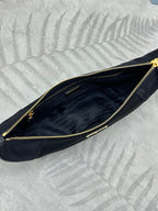Prada crescent hobo bag interior with gold zipper trim and dark navy lining